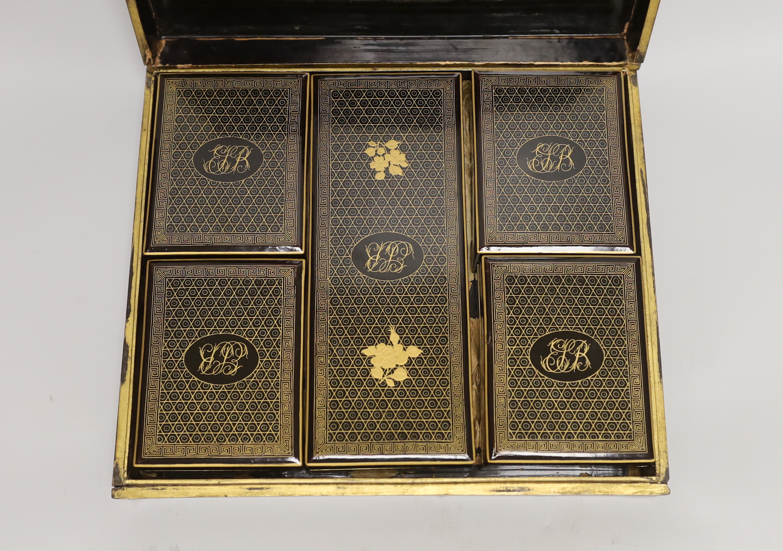 A Victorian gaming set with mother of pearl counters, contained in a mid 19th century Canton gilt decorated like a box with lidded containers, 29cm